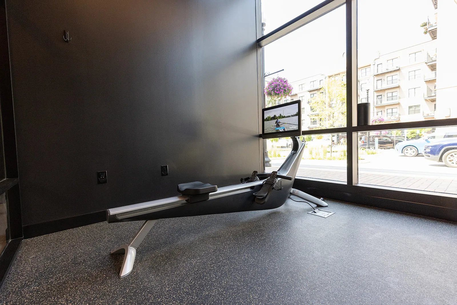 A HYDROW rower beside the window in a FlexWerk cardio space
