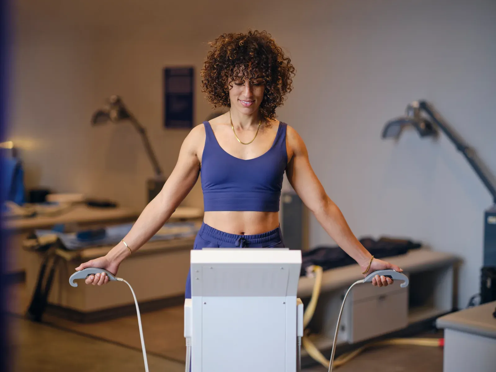 A person about to step onto a body composition analysis machine