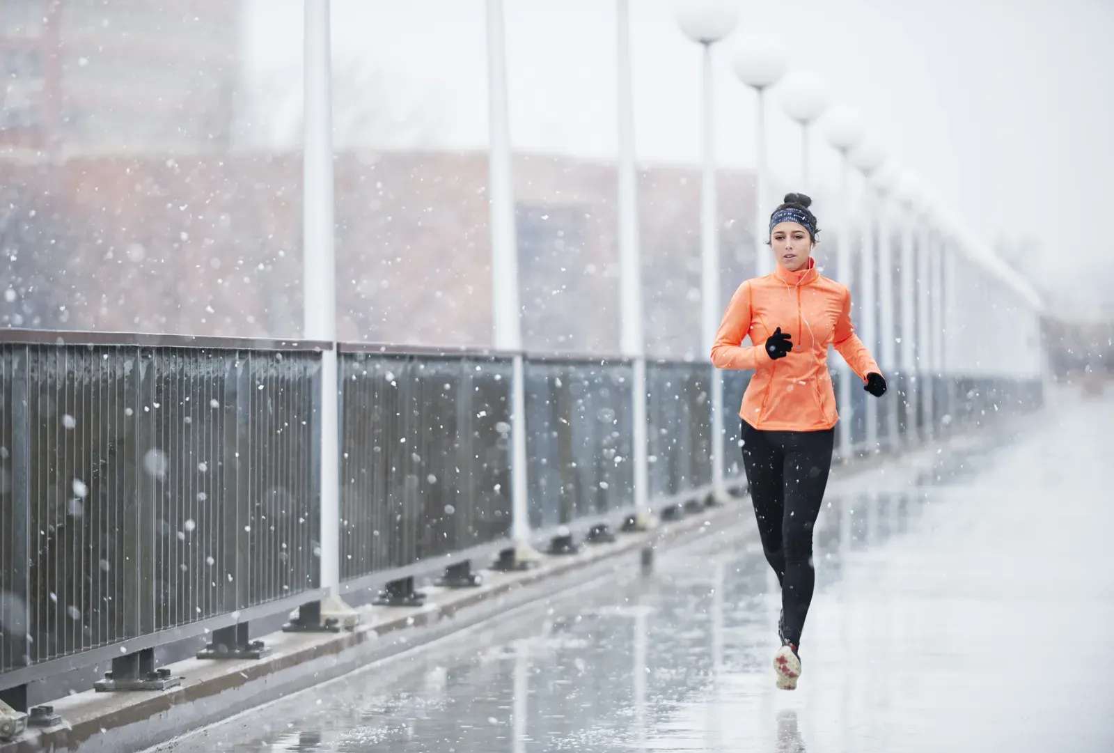 Determined runner training outdoors in rough weather, the kind of grit 75 Hard demands