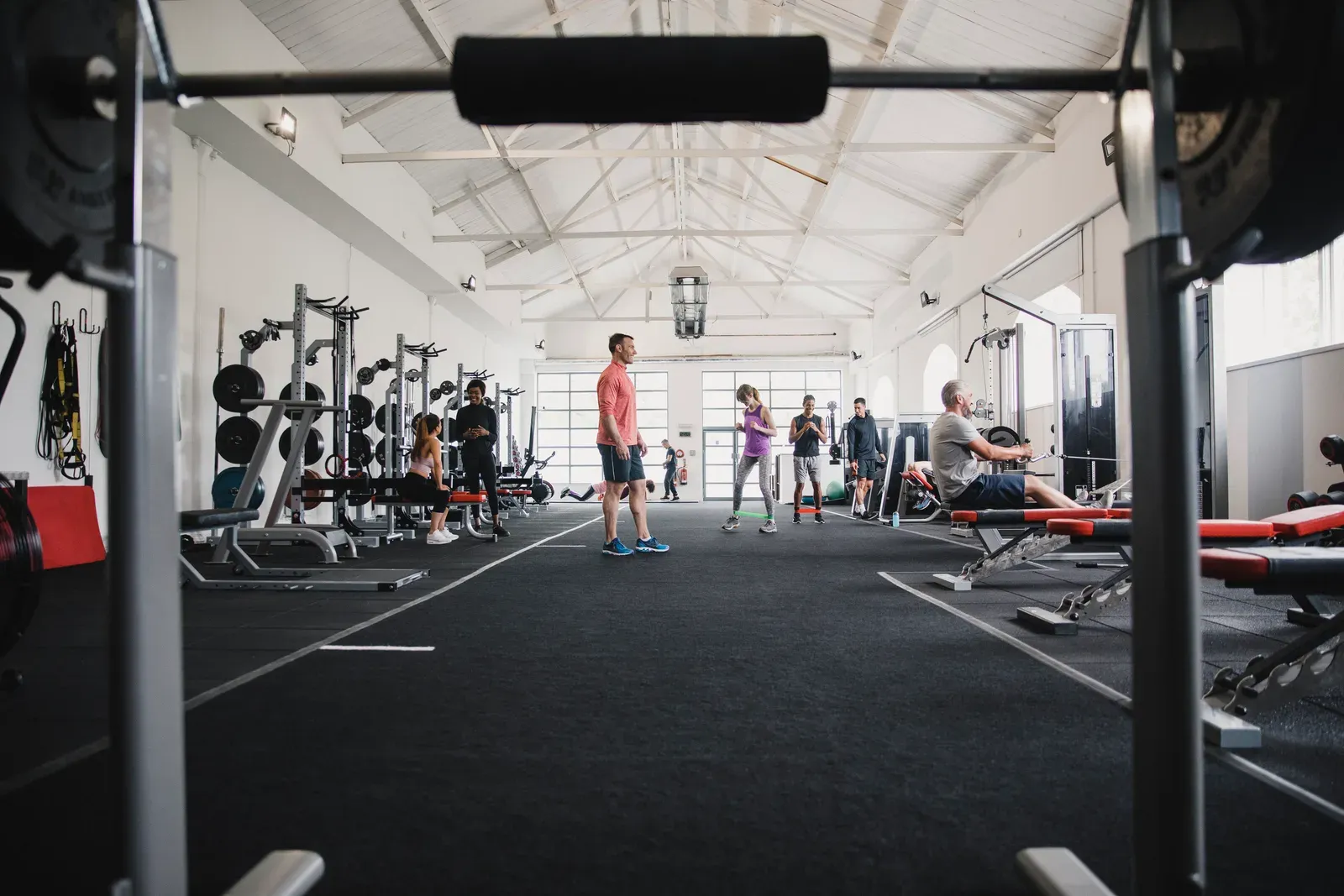 Members working out across a busy gym floor on a packed day