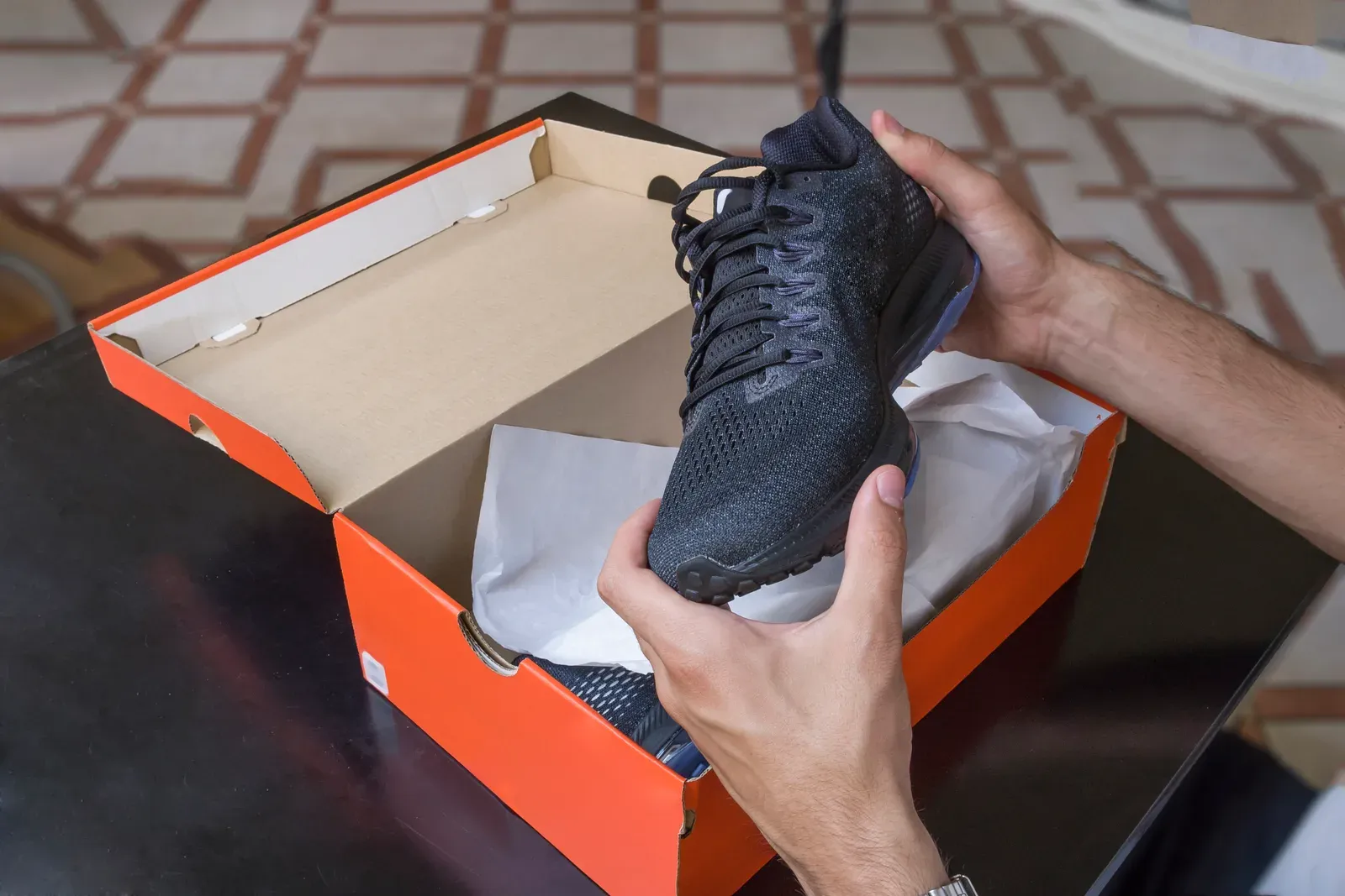 Fresh pair of training shoes in the box, ready for a restart