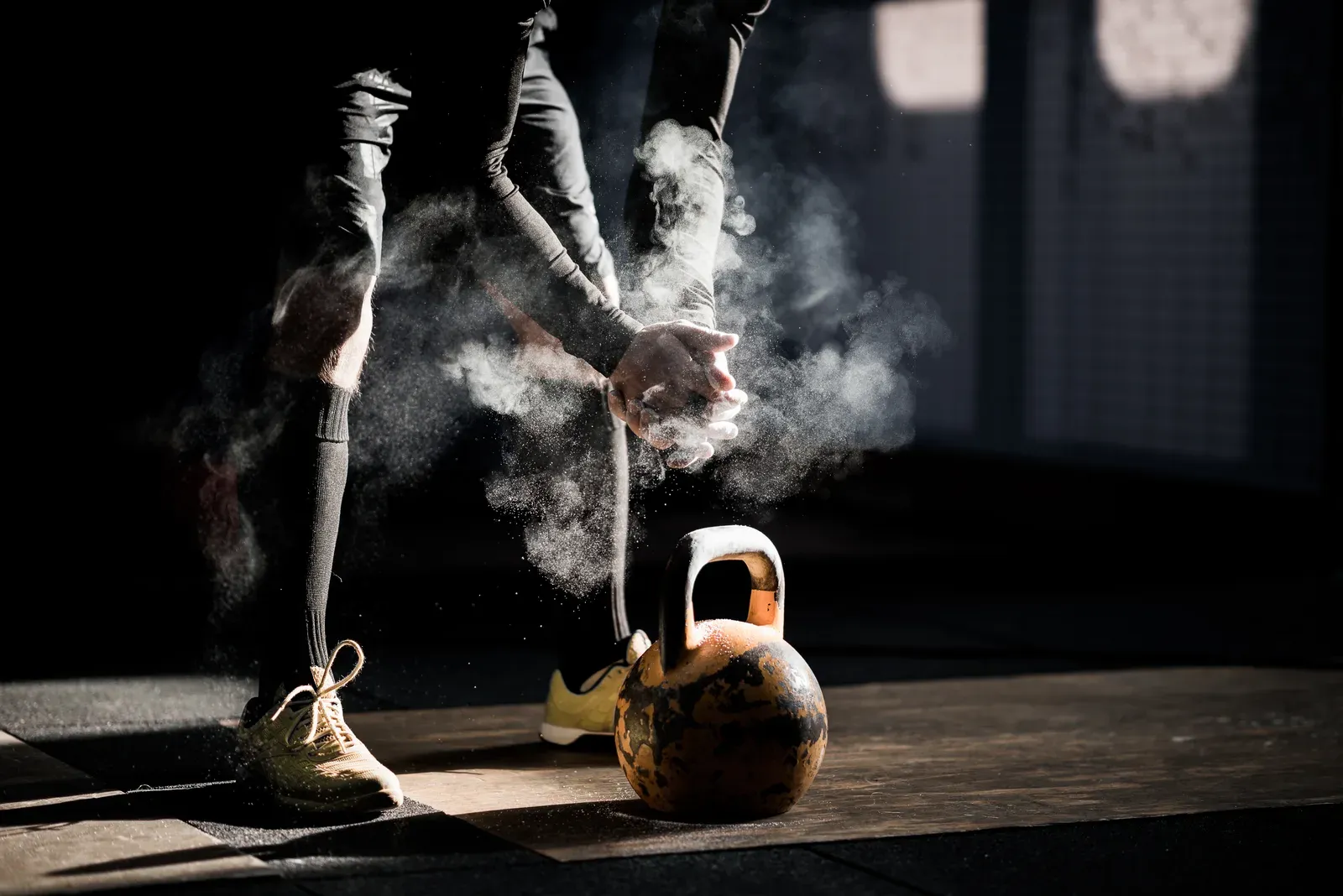 A man in the gym working through a kettlebell set to push past a sticking point